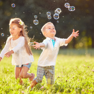 2 children in field with bubbles.png